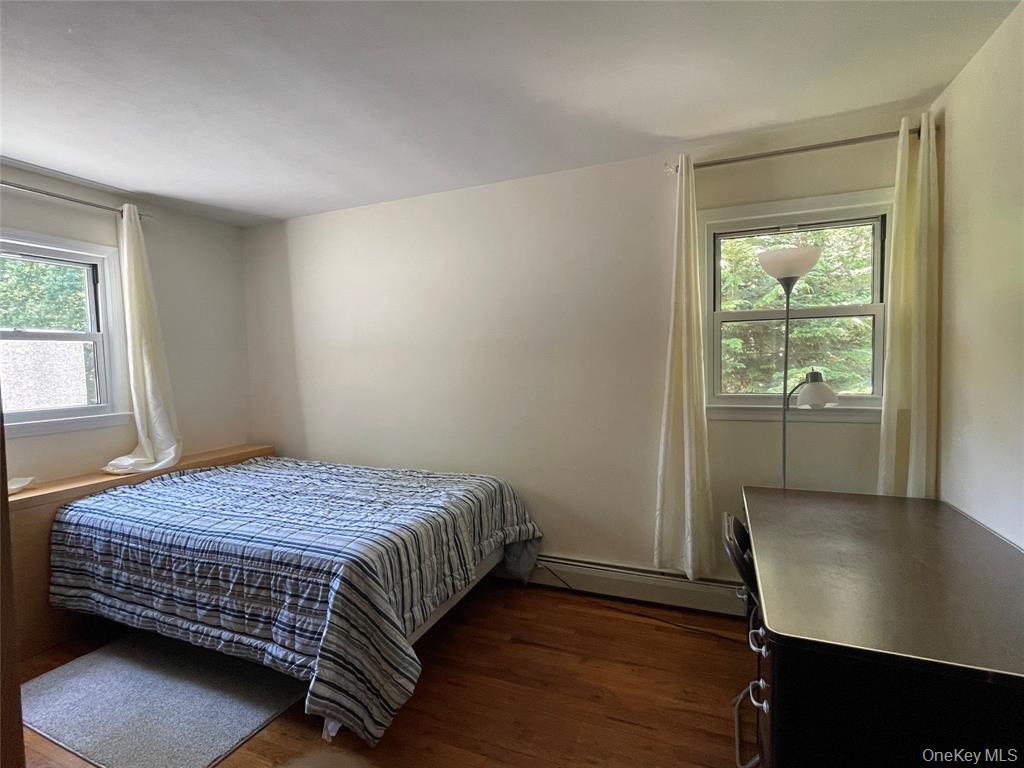 4 Cornwallis Road East Setauket, NY 11733 - Photo 15 of 16 a bedroom with a bed and window