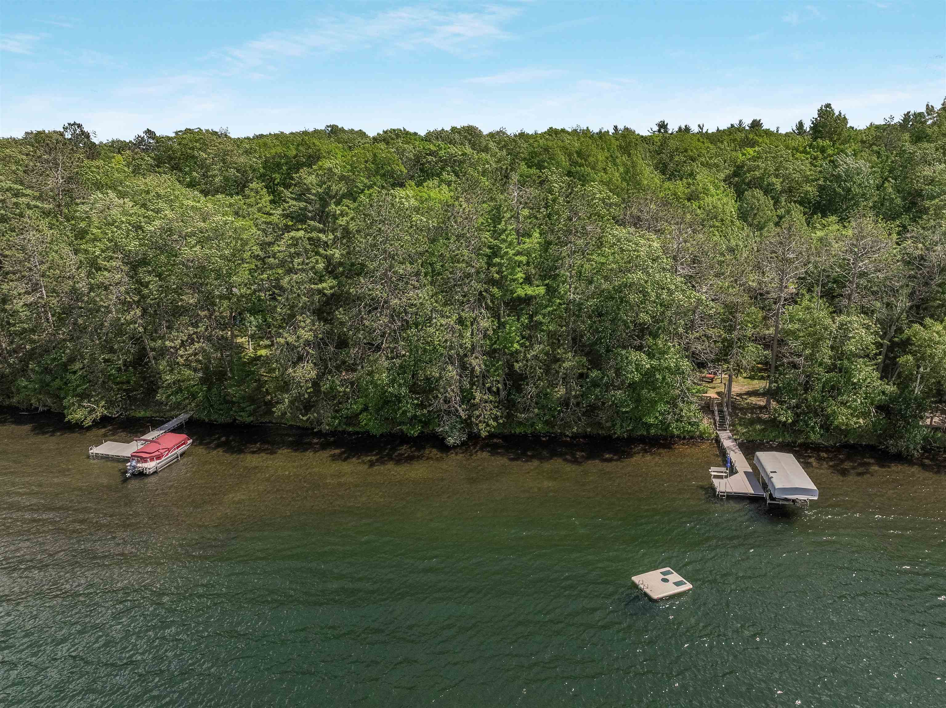 Lot 1 Thoroughfare Road Stone Lake, WI 54876 - Photo 11 of 12 Water view featuring a heavily wooded area and a floating dock