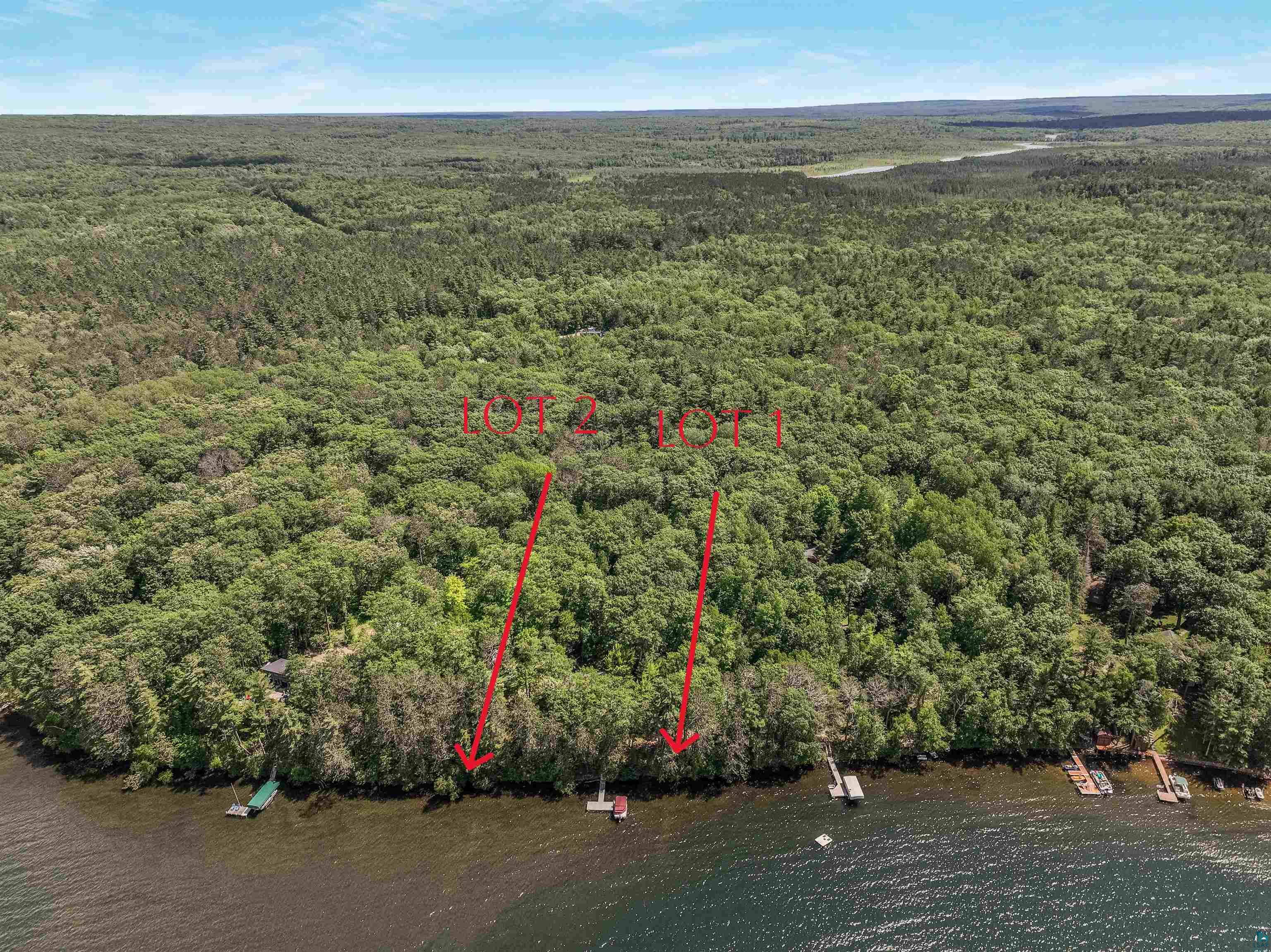 Lot 1 Thoroughfare Road Stone Lake, WI 54876 - Photo 3 of 12 Aerial view of a forest and a large body of water