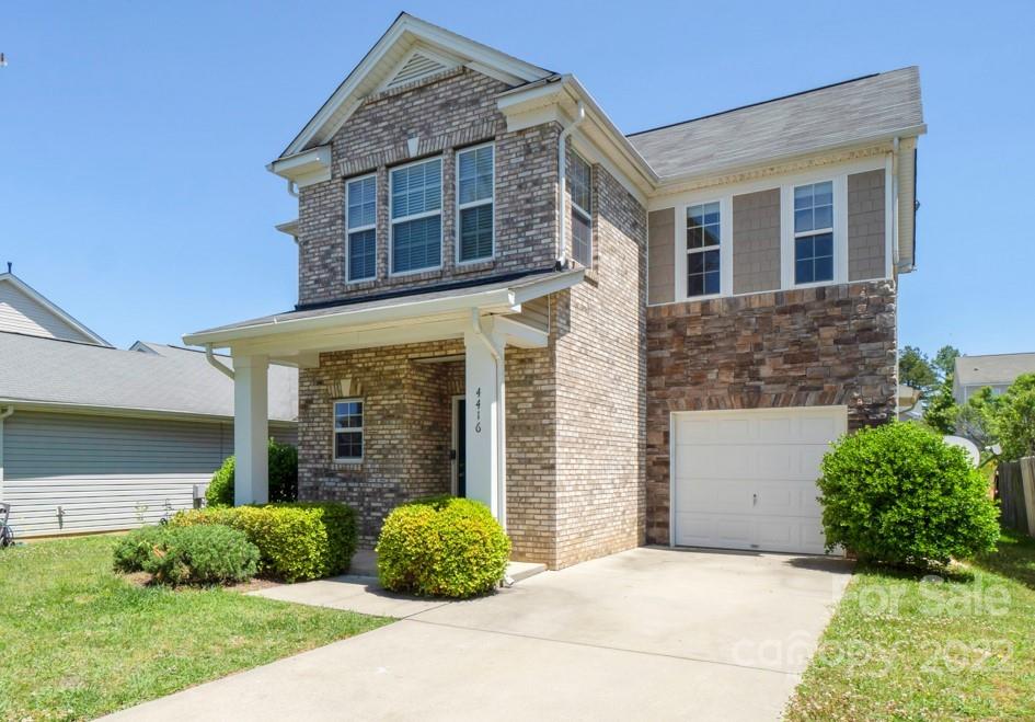 front view of a house with a yard