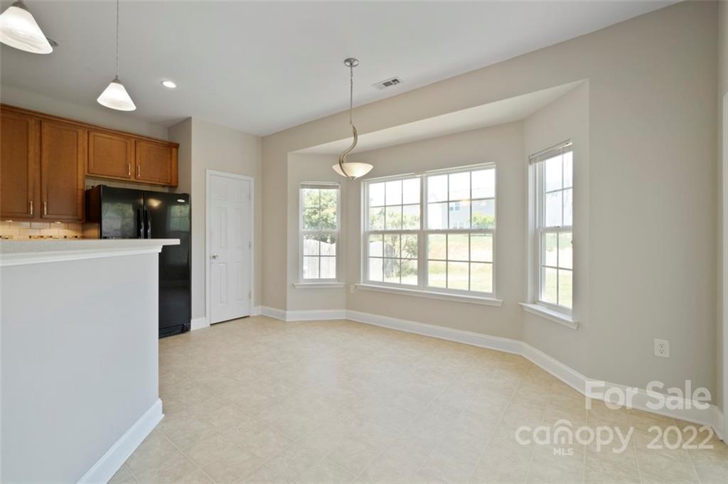 4416 Marys Point Road Monroe, NC 28110 - Photo 12 of 33 a view of a kitchen with a sink dishwasher and a refrigerator