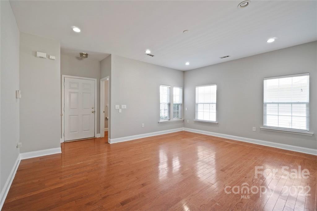 4416 Marys Point Road Monroe, NC 28110 - Photo 13 of 33 a view of empty room with wooden floor and fan