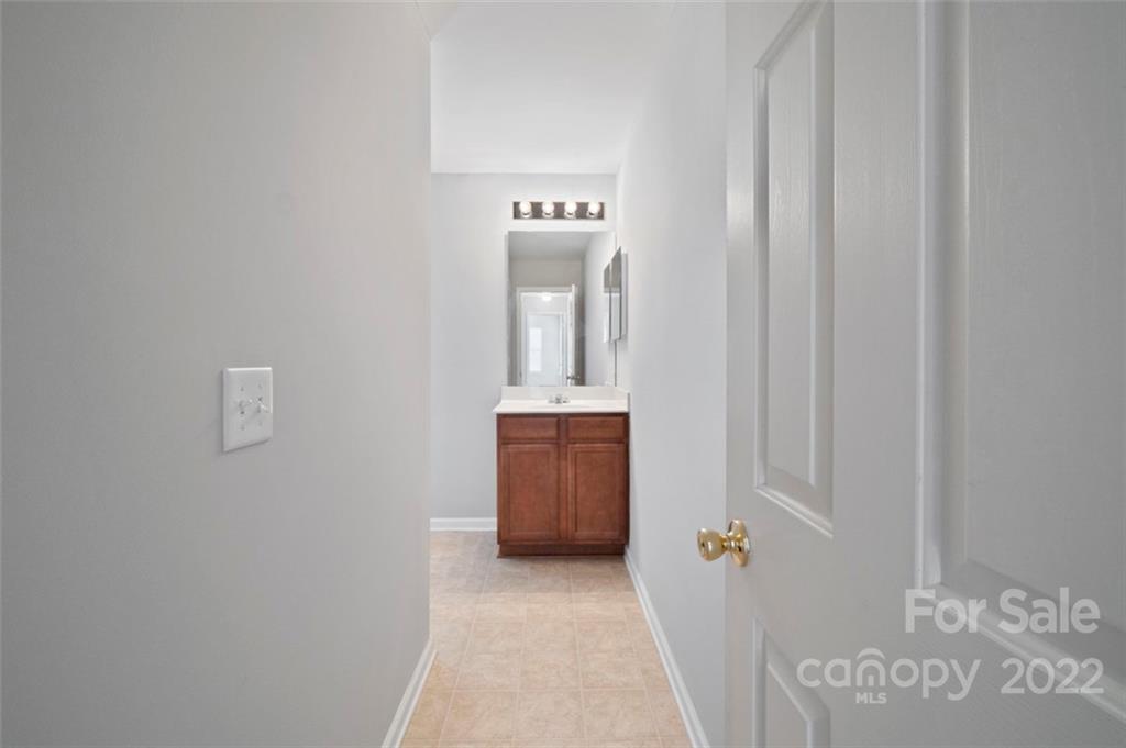 4416 Marys Point Road Monroe, NC 28110 - Photo 20 of 33 a bathroom with a sink and a mirror