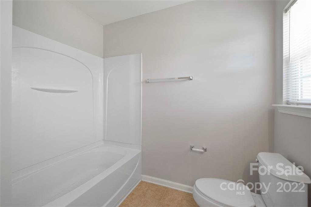 4416 Marys Point Road Monroe, NC 28110 - Photo 21 of 33 a bathroom with a sink a toilet and bathtub