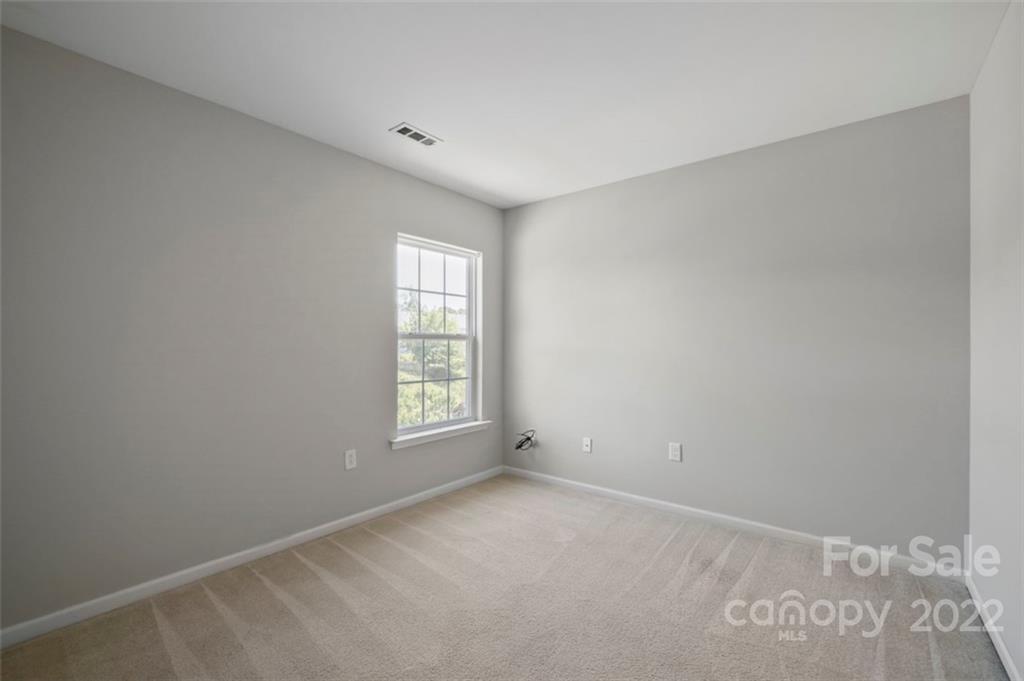 4416 Marys Point Road Monroe, NC 28110 - Photo 22 of 33 an empty room with windows
