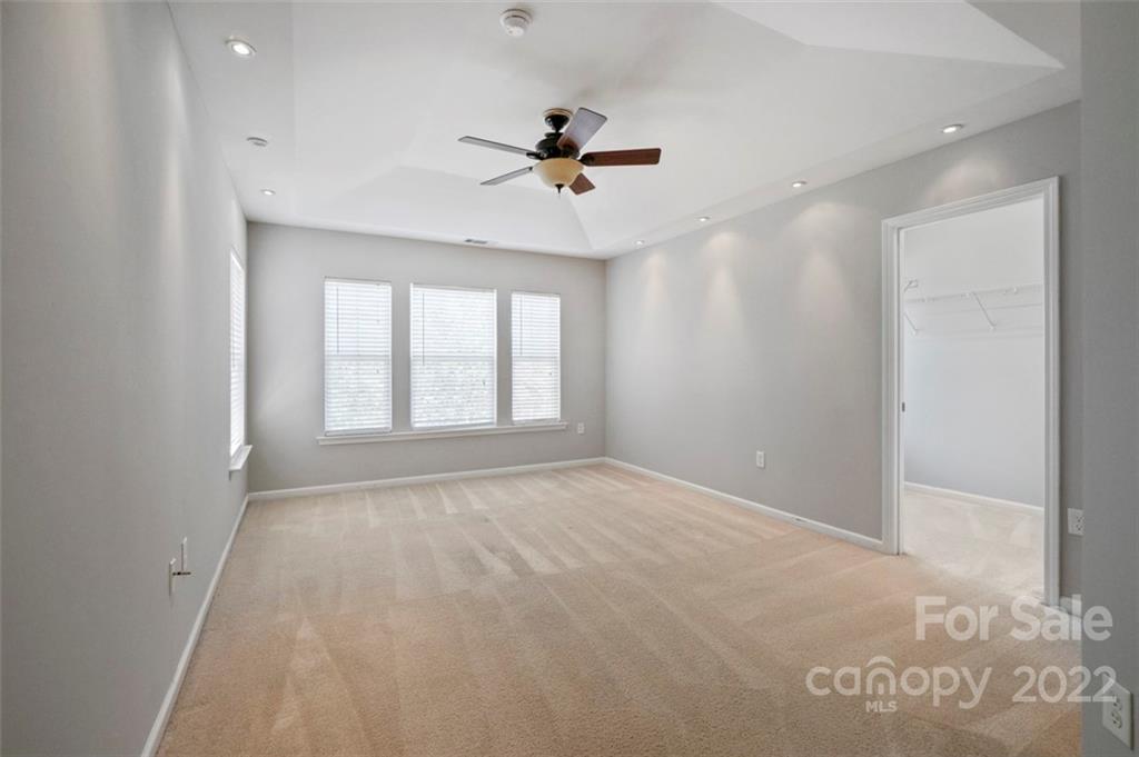 4416 Marys Point Road Monroe, NC 28110 - Photo 26 of 33 an empty room with windows and ceiling fan