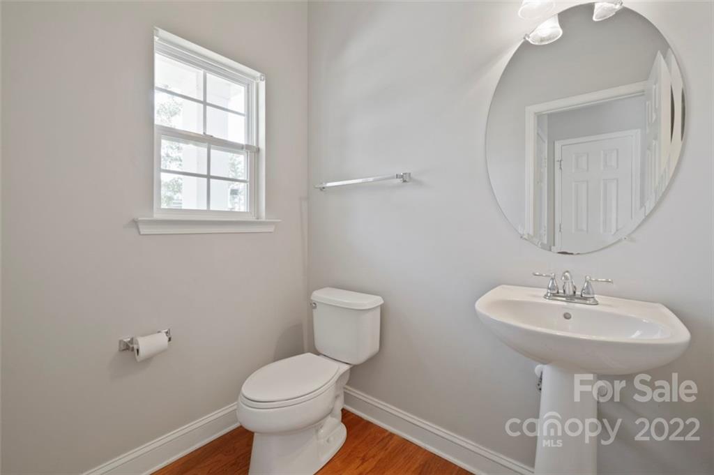 4416 Marys Point Road Monroe, NC 28110 - Photo 5 of 33 a bathroom with a toilet sink and mirror