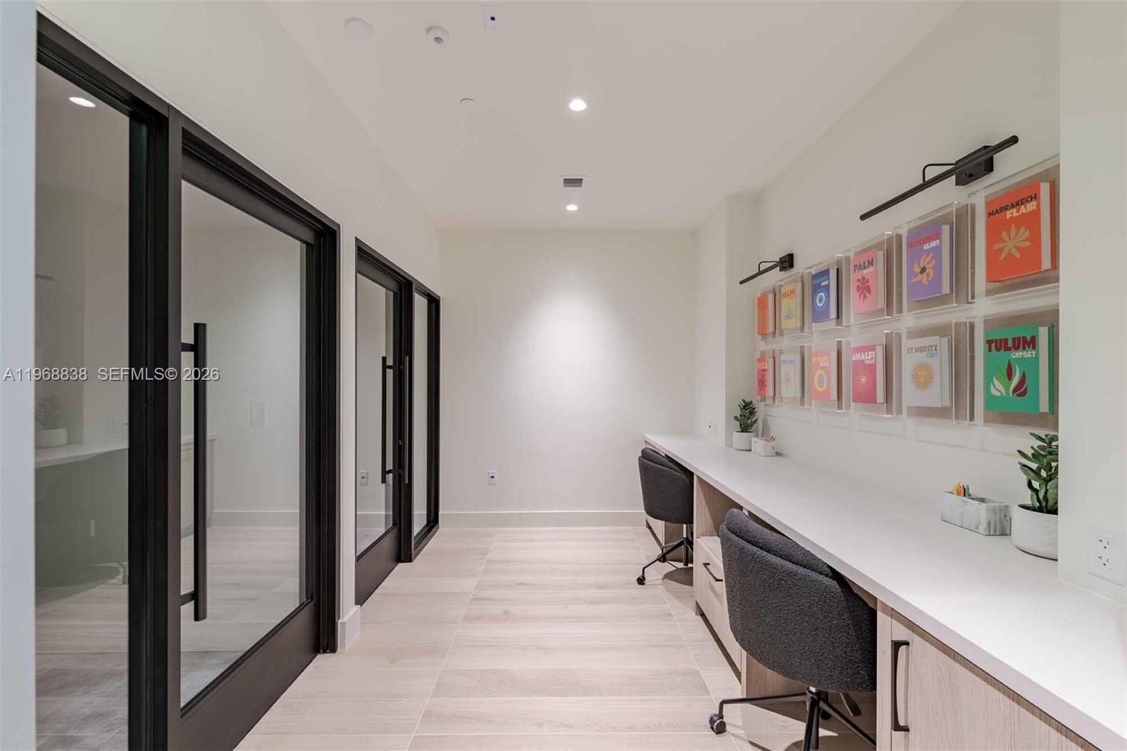 3900 Alton Road, Unit 318 Miami Beach, FL 33140 - Photo 24 of 42 a workspace with furniture and window