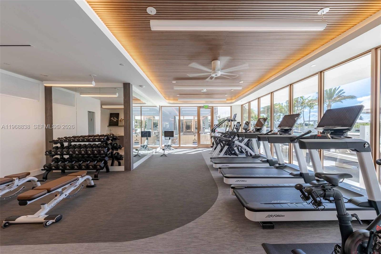 3900 Alton Road, Unit 318 Miami Beach, FL 33140 - Photo 27 of 42 a view of a room with gym equipment