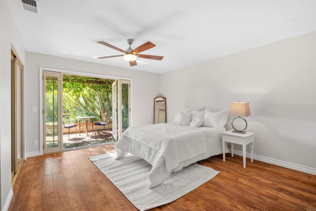 485 Wax Flower Lane Fallbrook, CA 92028 - Photo 11 of 31 a bedroom with a bed and a large window