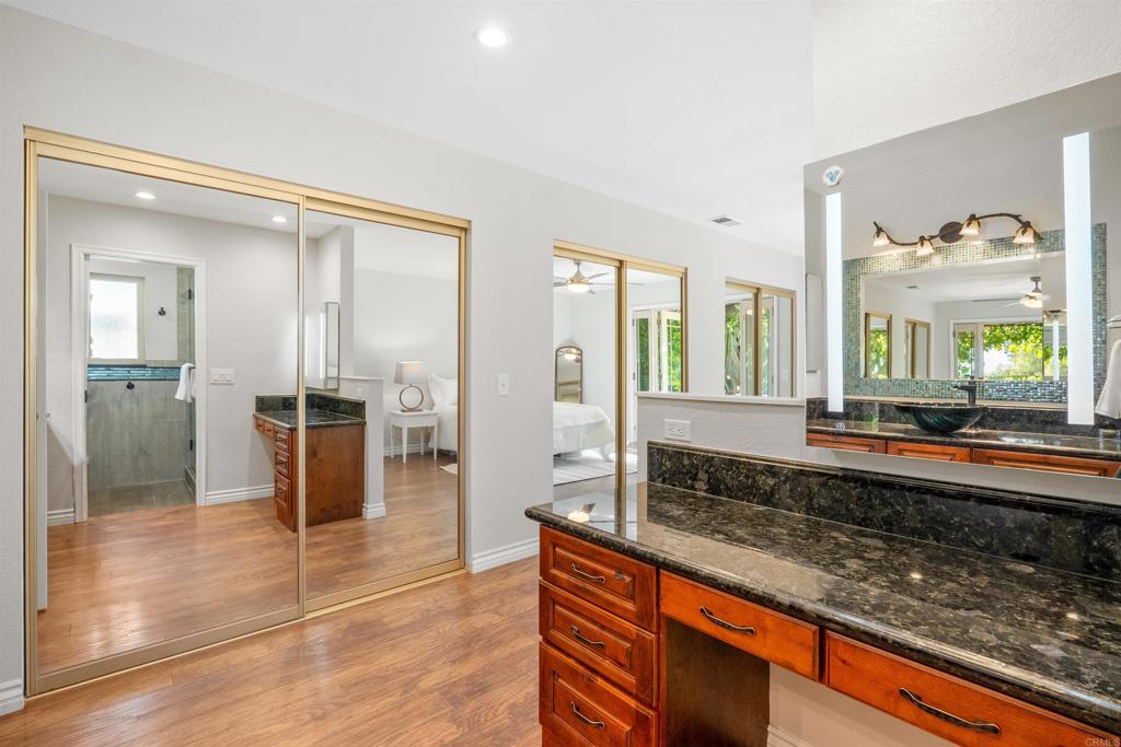 485 Wax Flower Lane Fallbrook, CA 92028 - Photo 14 of 31 a large bathroom with a large tub and sink
