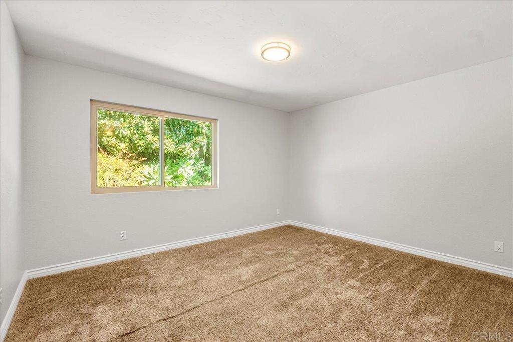 485 Wax Flower Lane Fallbrook, CA 92028 - Photo 18 of 31 an empty room with a window