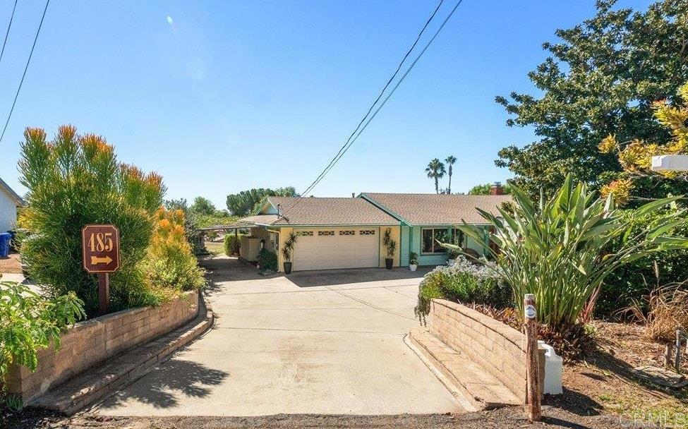 485 Wax Flower Lane Fallbrook, CA 92028 - Photo 29 of 31 a view of a house with a yard