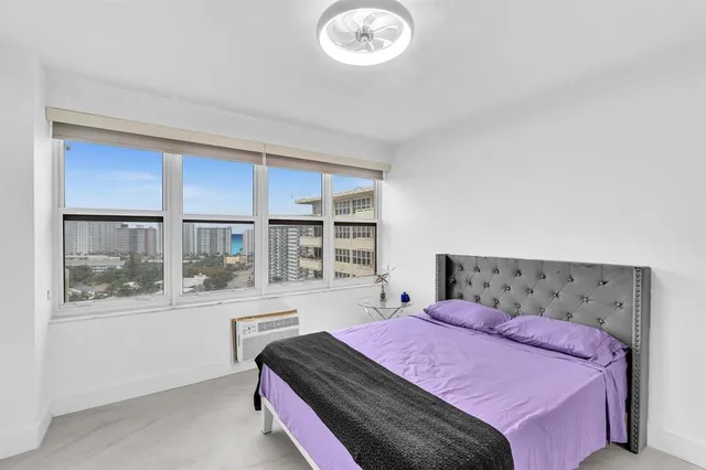 a bedroom with a bed and a cabinets