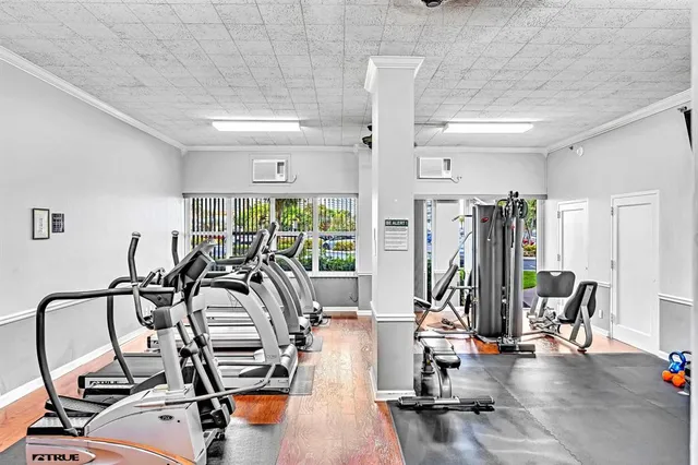 a view of a livingroom with furniture and a bookshelf