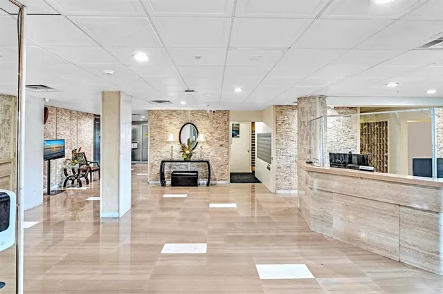 a view of a swimming pool with a bench and a fountain