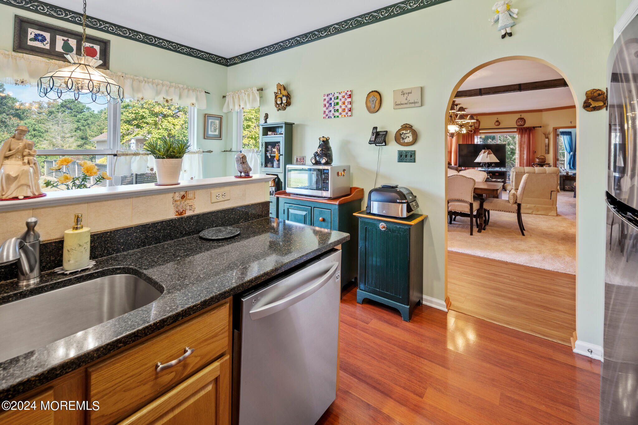 9 Hampton Road Manahawkin, NJ 08050 - Photo 18 of 50 a kitchen with stainless steel appliances granite countertop a sink and a refrigerator
