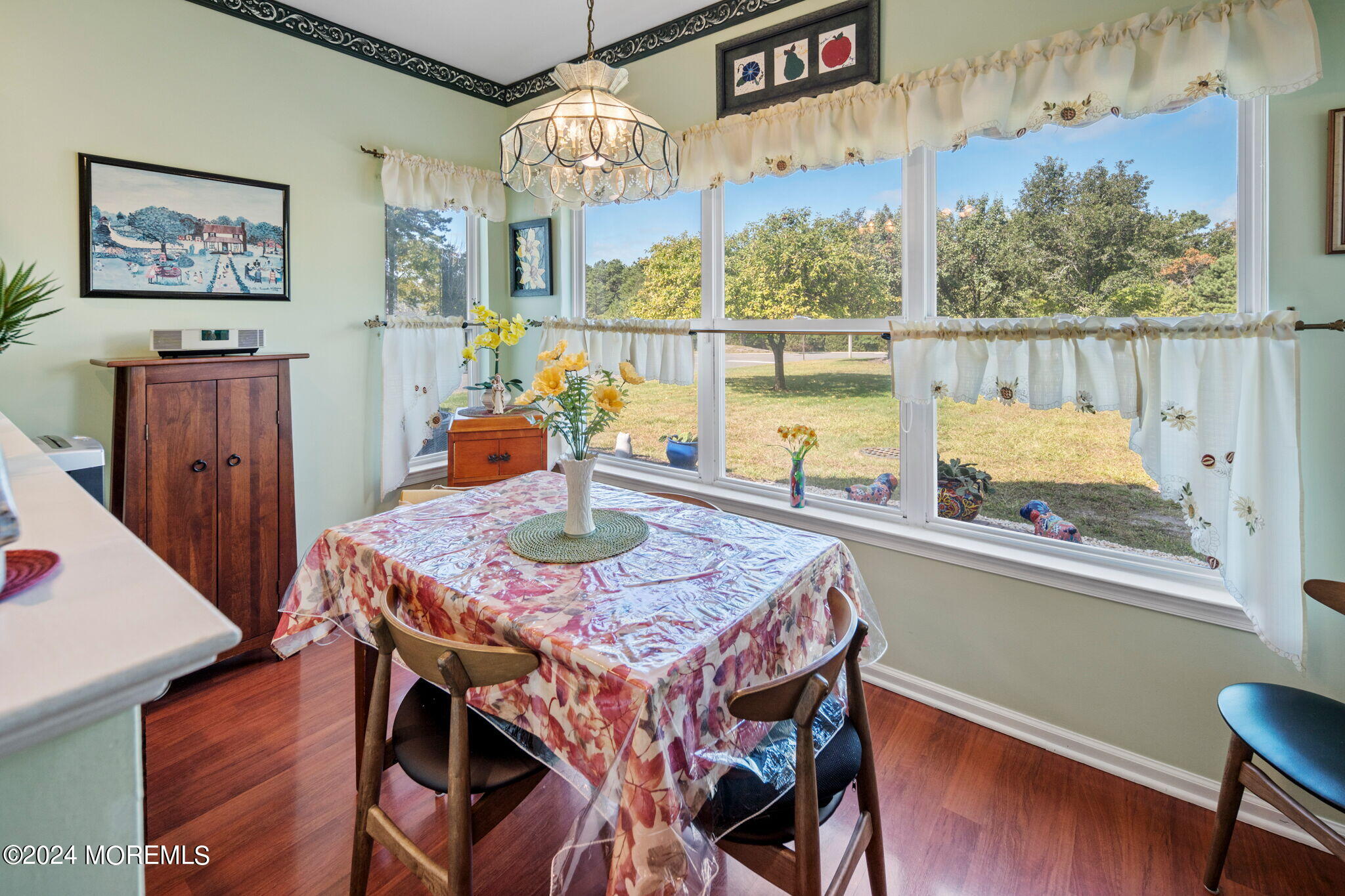 9 Hampton Road Manahawkin, NJ 08050 - Photo 20 of 50 a view of a dining room with furniture a chandelier and wooden floor
