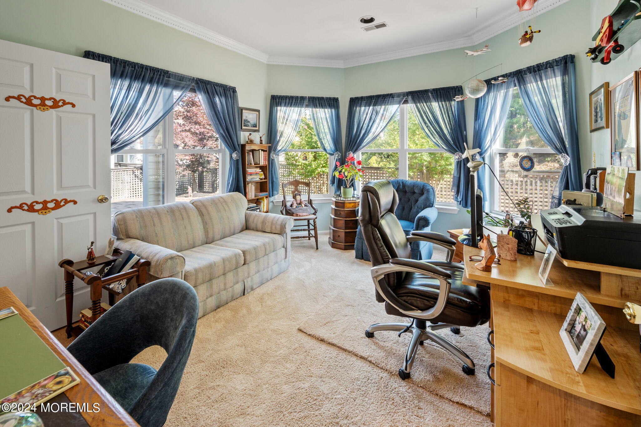 9 Hampton Road Manahawkin, NJ 08050 - Photo 29 of 50 a living room with furniture a large window and gym equipment