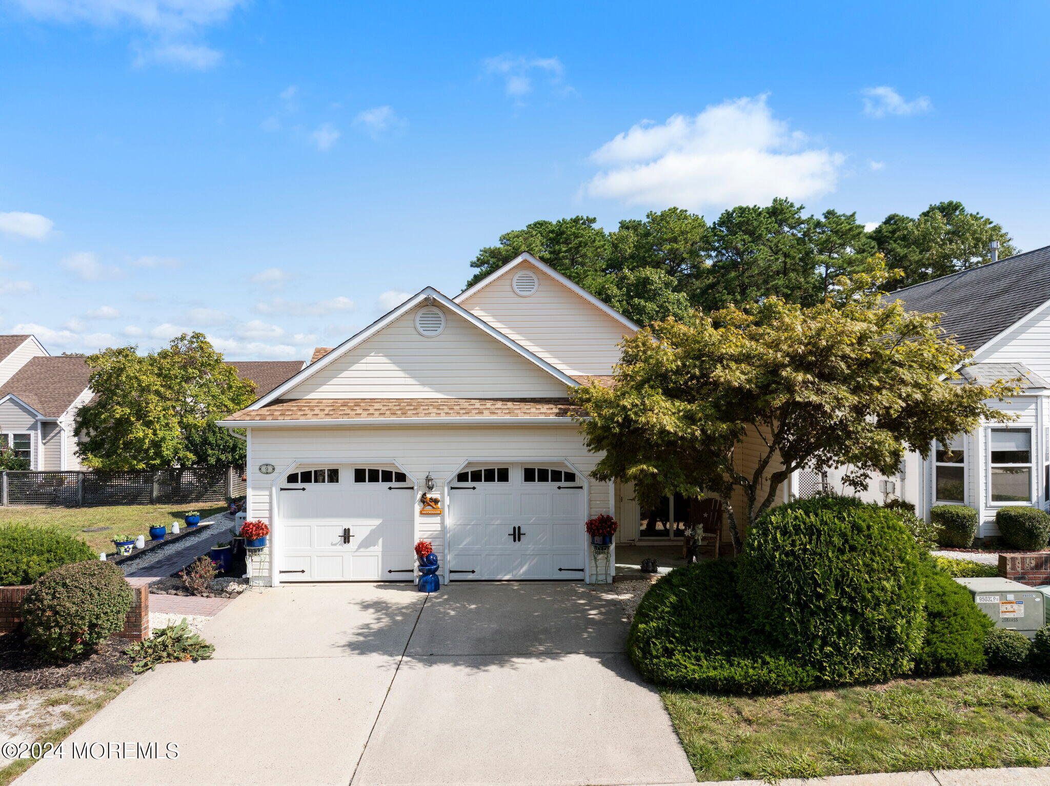 9 Hampton Road Manahawkin, NJ 08050 - Photo 38 of 50 a view of a white house with a yard and plants