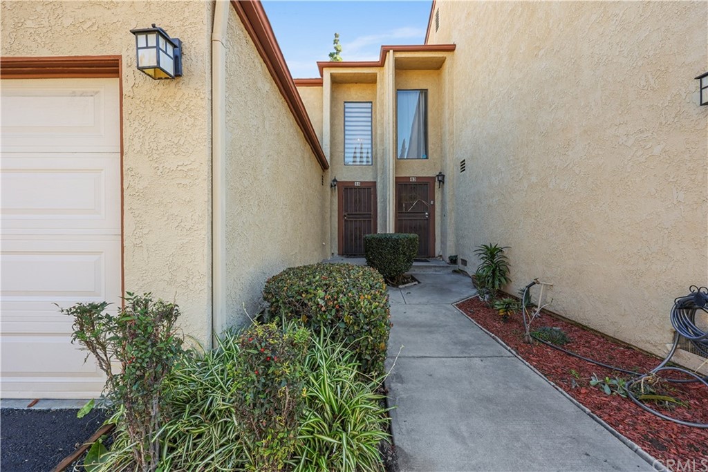 555 South Azusa Avenue, Unit 44 Azusa, CA 91702 - Photo 1 of 1 a house with a flower garden in front of it