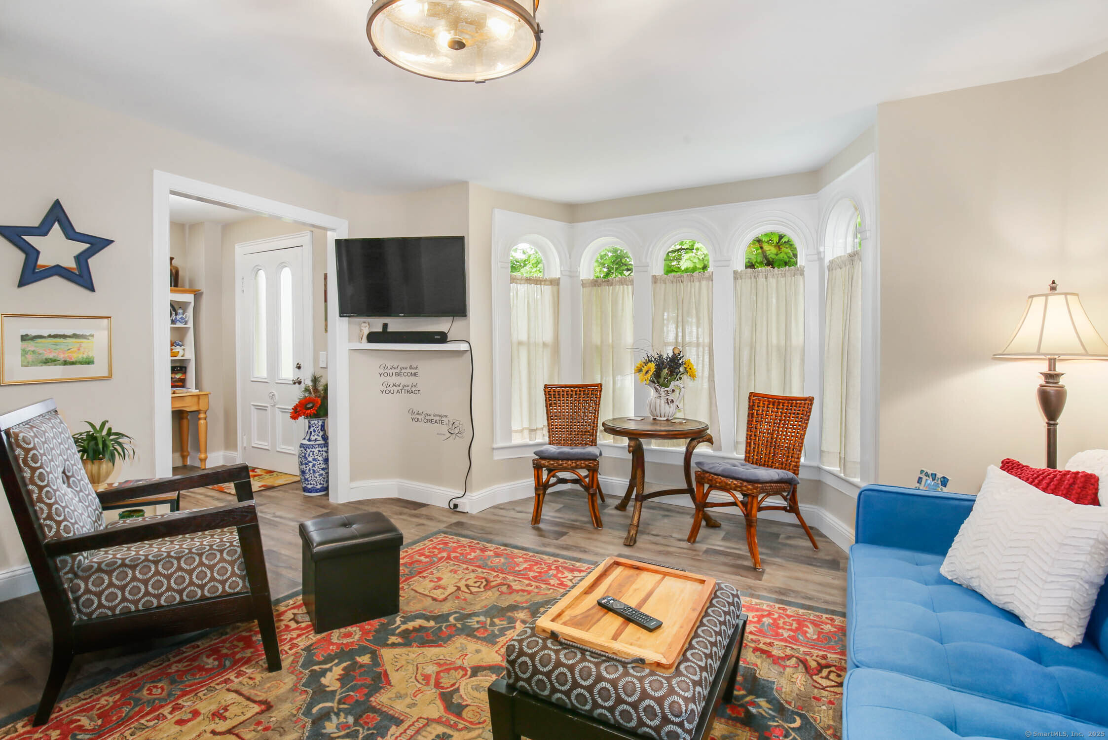 48 Wrights Crossing Road Pomfret, CT 06259 - Photo 15 of 34 a living room with furniture a flat screen tv and a window
