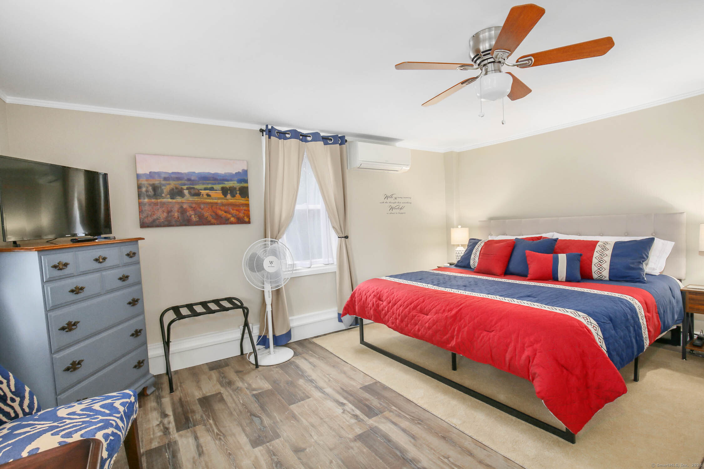 48 Wrights Crossing Road Pomfret, CT 06259 - Photo 18 of 34 a bedroom with a bed and a flat screen tv