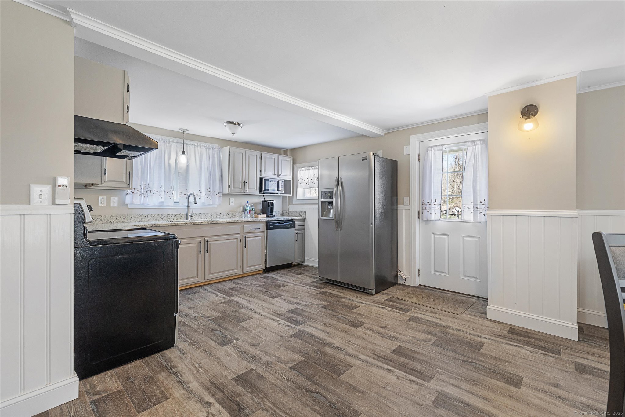 48 Wrights Crossing Road Pomfret, CT 06259 - Photo 20 of 34 a kitchen with a sink a refrigerator and cabinets