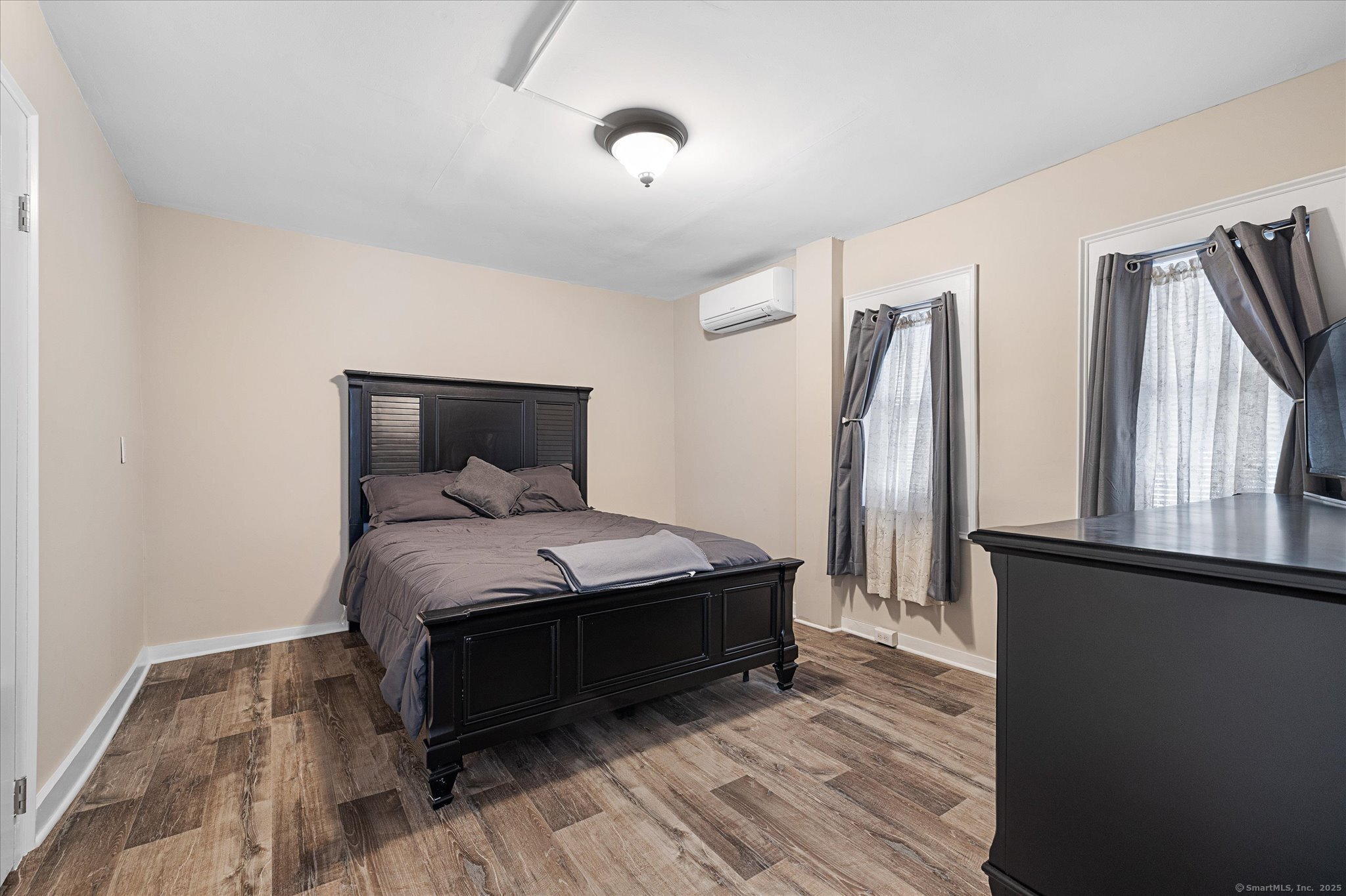 48 Wrights Crossing Road Pomfret, CT 06259 - Photo 24 of 34 a bedroom with a bed and wooden floor