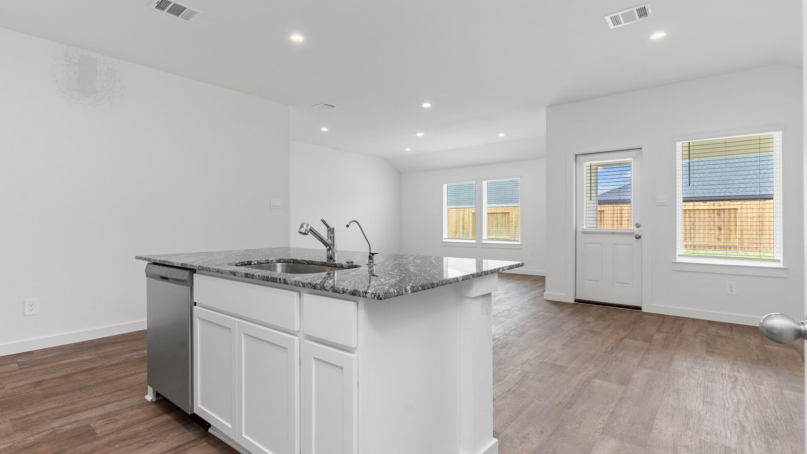 4520 Highland Oaks Court Rosenberg, TX 77469 - Photo 17 of 48 a view of a kitchen counter space and wooden floor