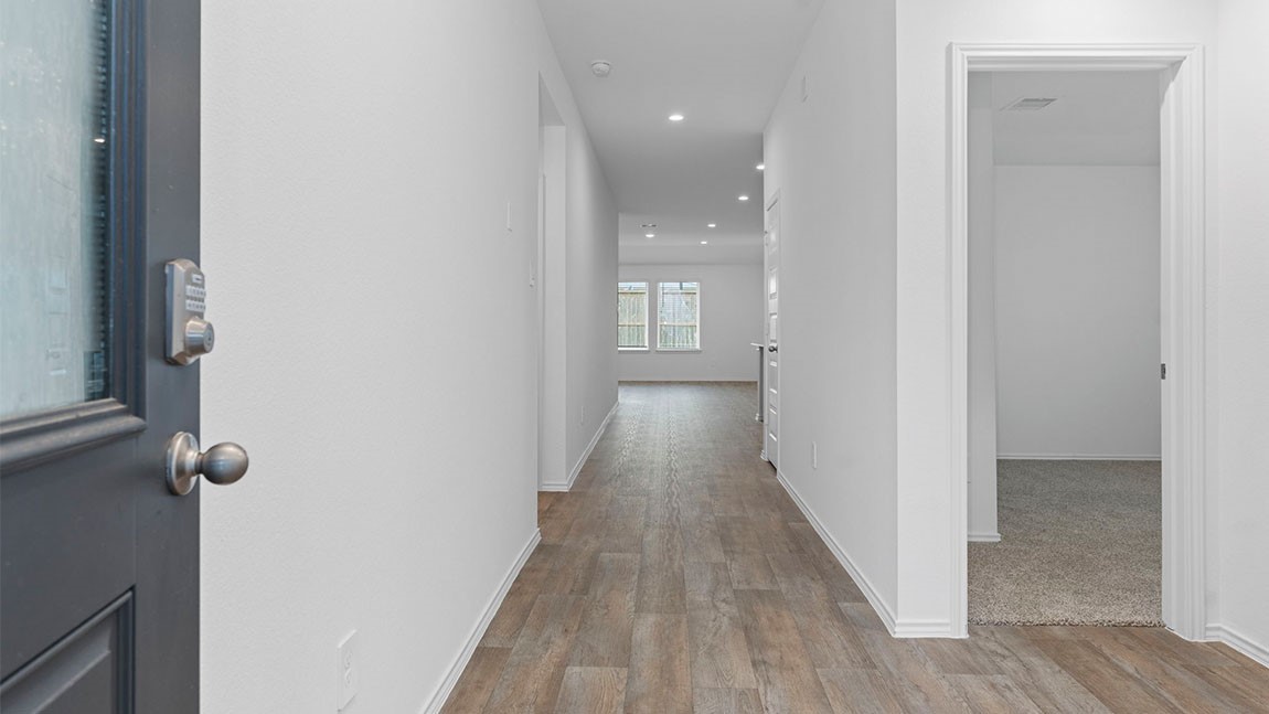 4520 Highland Oaks Court Rosenberg, TX 77469 - Photo 3 of 48 a view of a hallway with wooden floor
