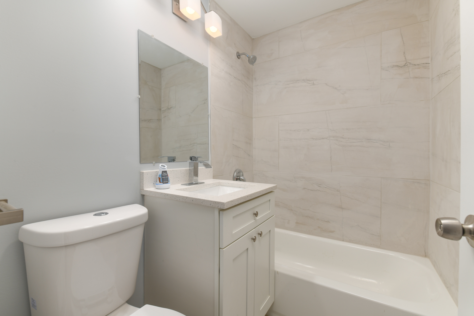 16542 Paulina Street Markham, IL 60428 - Photo 18 of 29 a bathroom with a sink a toilet and shower