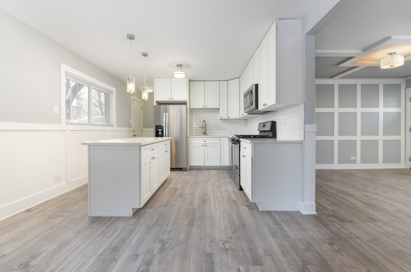 16542 Paulina Street Markham, IL 60428 - Photo 5 of 29 a kitchen with stainless steel appliances a refrigerator sink and cabinets