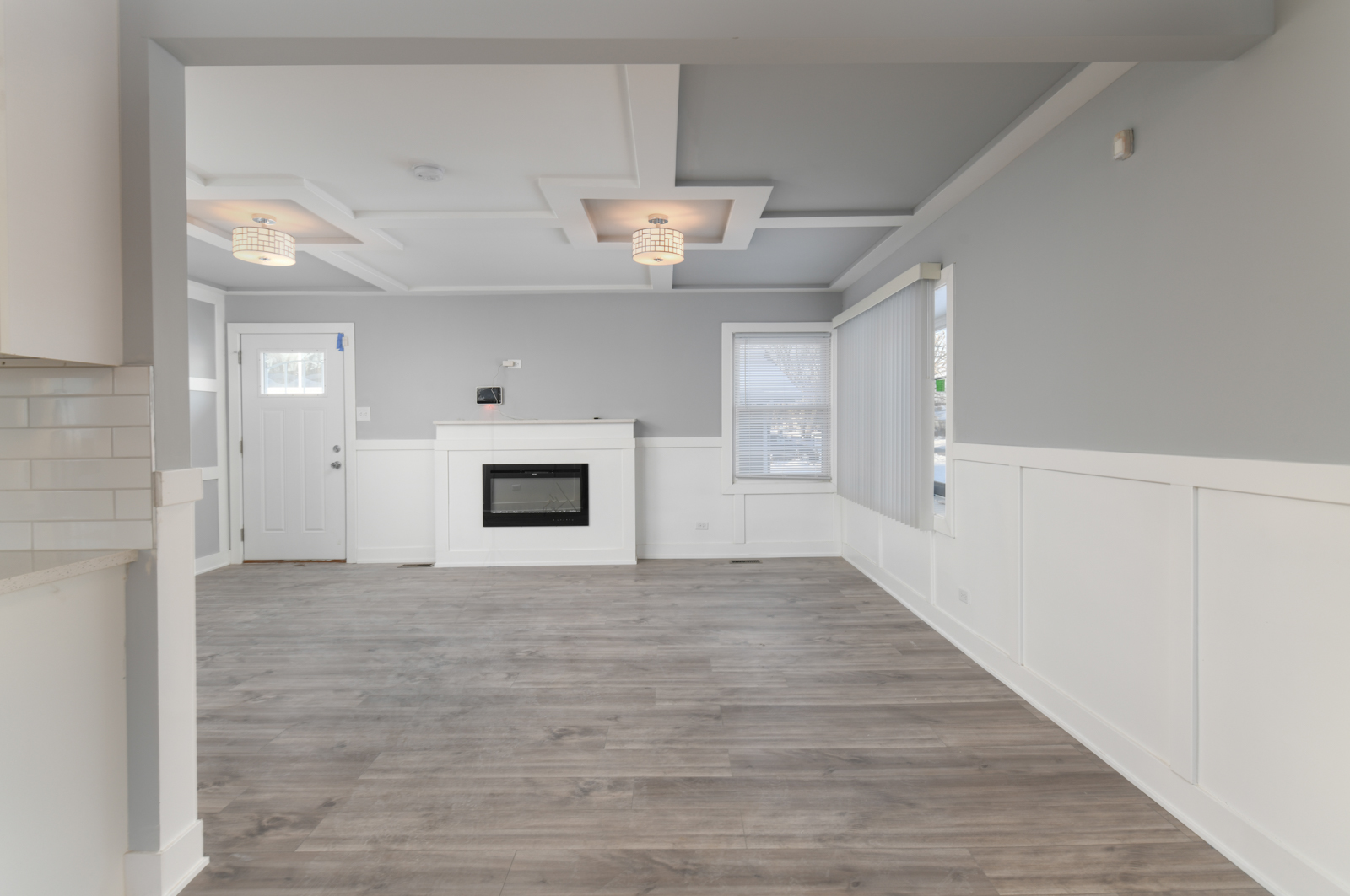 16542 Paulina Street Markham, IL 60428 - Photo 9 of 29 wooden floor in an empty room with a fireplace