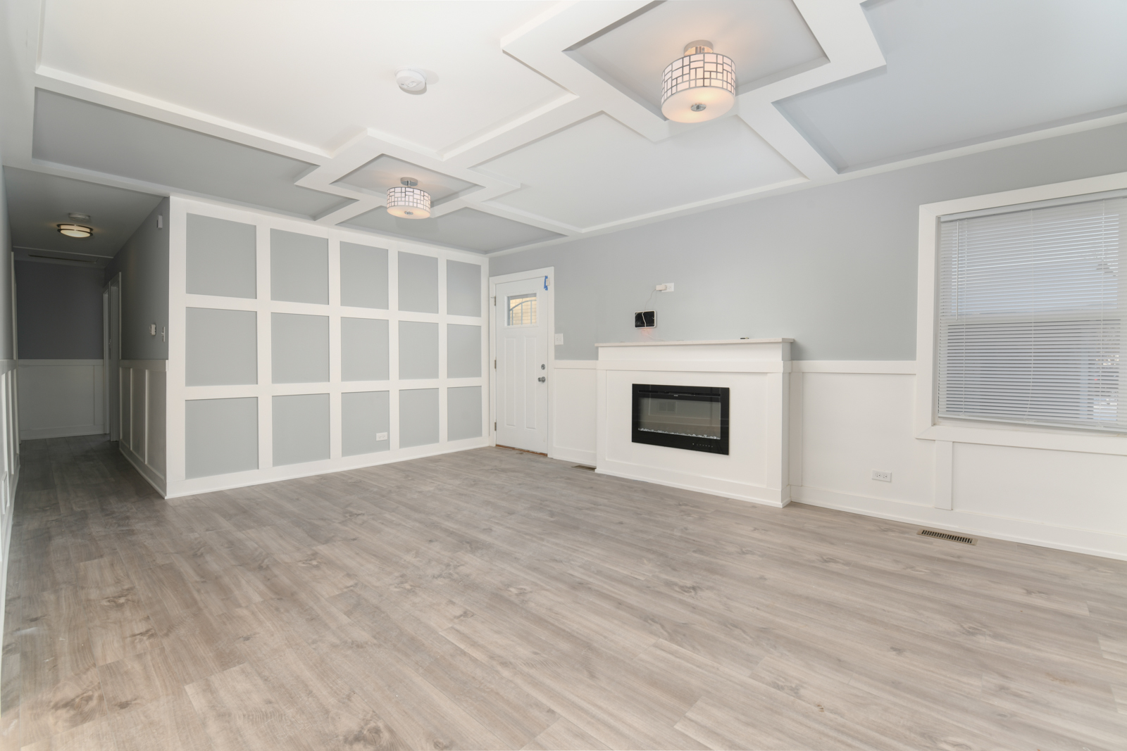 16542 Paulina Street Markham, IL 60428 - Photo 10 of 29 an empty room with windows and fireplace