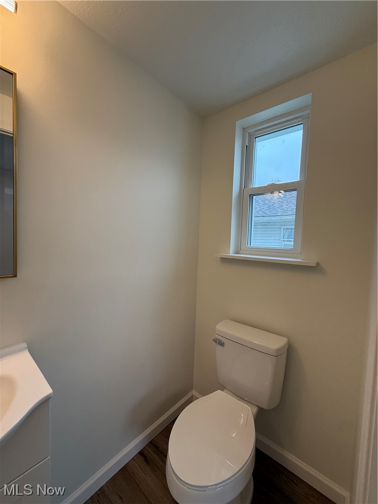522 North 3rd Street Toronto, OH 43964 - Photo 30 of 47 Half bath featuring vanity and dark wood-type flooring