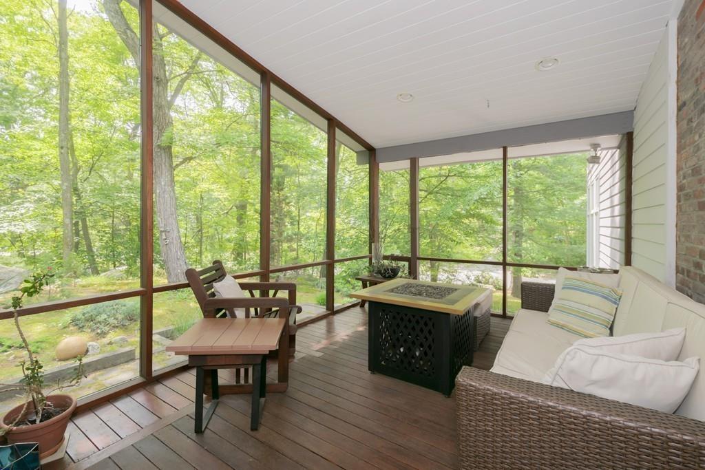 15 Turning Mill Road Lexington, MA 02420 - Photo 21 of 42 a living room with furniture and a floor to ceiling window