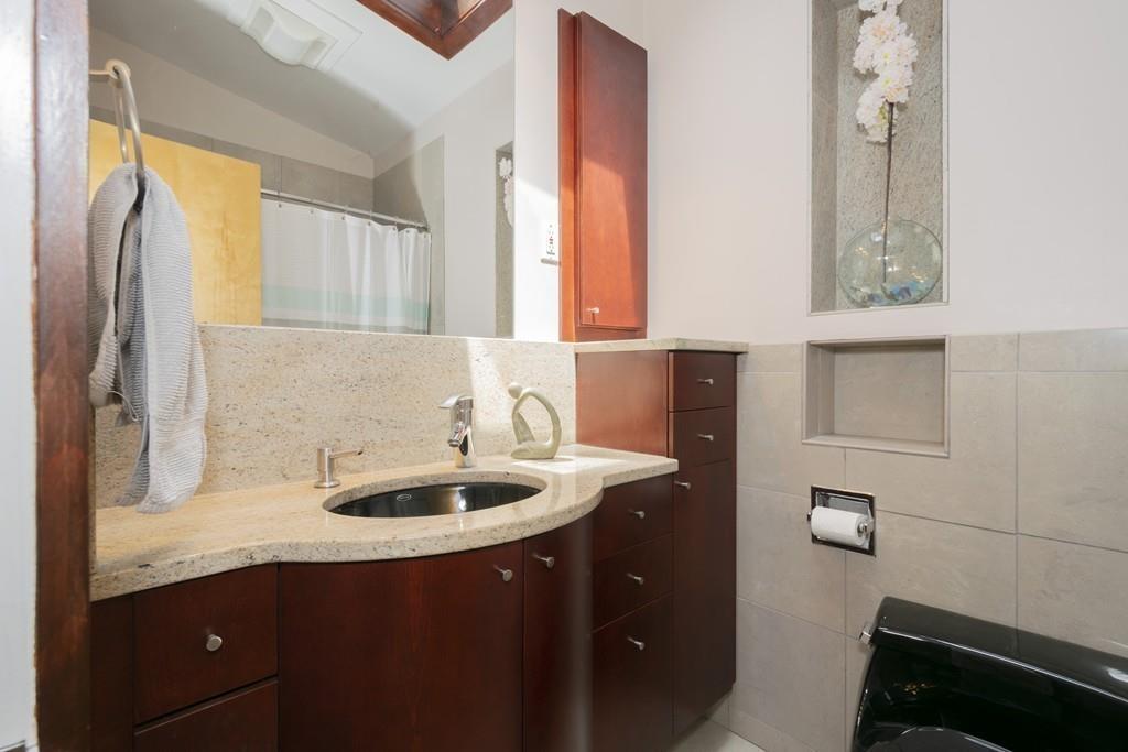 15 Turning Mill Road Lexington, MA 02420 - Photo 34 of 42 a bathroom with a sink and a mirror