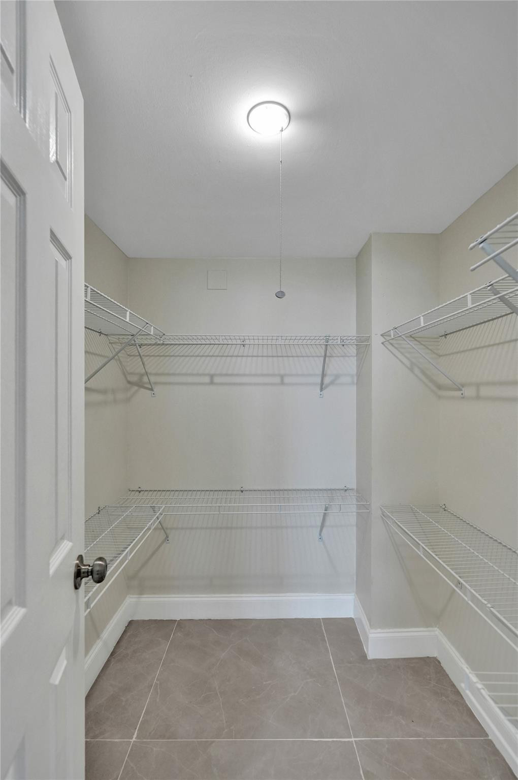 4222 Inverrary Boulevard, Unit 4810 Lauderhill, FL 33319 - Photo 40 of 63 a bathroom with a bathtub