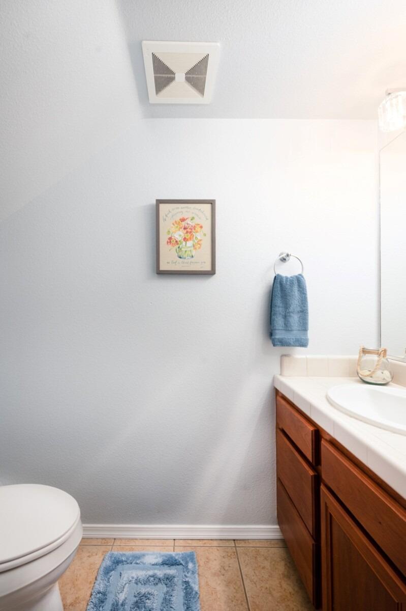 1968 North Tuscany Lane Clovis, CA 93619 - Photo 12 of 40 a bathroom with a sink and a toilet