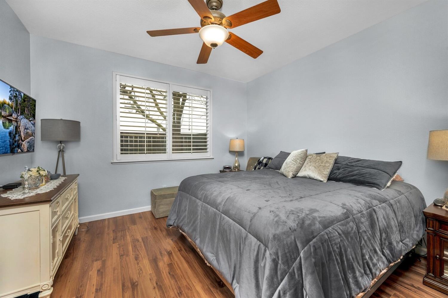 1968 North Tuscany Lane Clovis, CA 93619 - Photo 13 of 40 a bedroom with a bed and a window