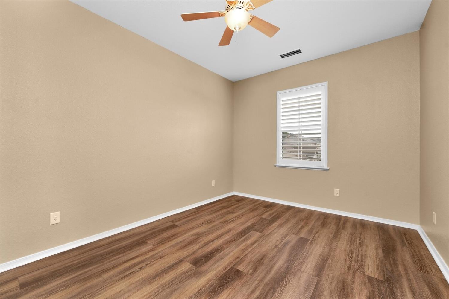 1968 North Tuscany Lane Clovis, CA 93619 - Photo 20 of 40 wooden floor in an empty room with a window
