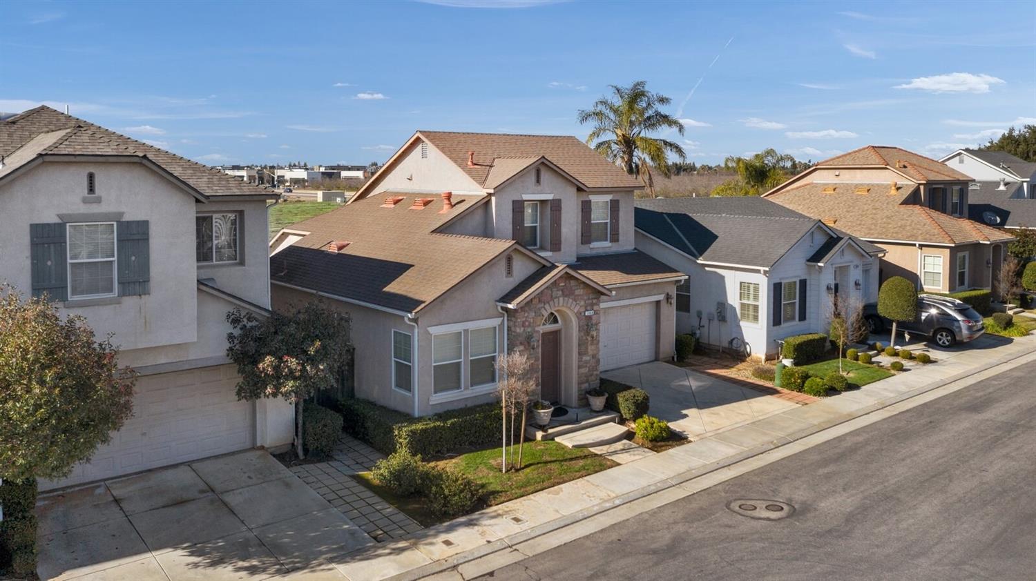 1968 North Tuscany Lane Clovis, CA 93619 - Photo 29 of 40 a front view of a house with a garden