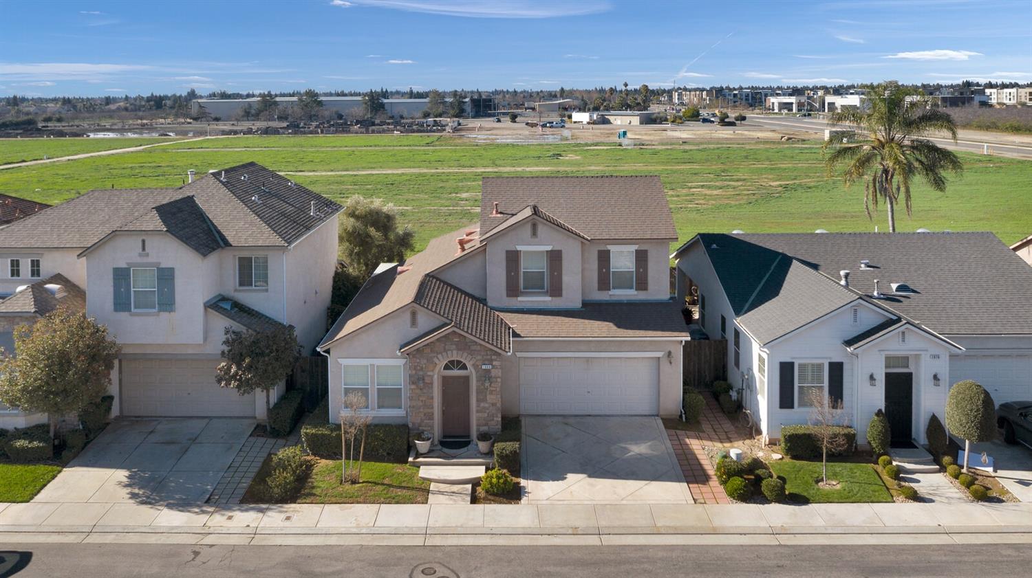 1968 North Tuscany Lane Clovis, CA 93619 - Photo 30 of 40 an aerial view of a house with a yard and outdoor seating