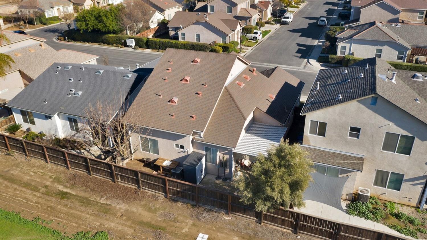 1968 North Tuscany Lane Clovis, CA 93619 - Photo 35 of 40 an aerial view of a house with a yard