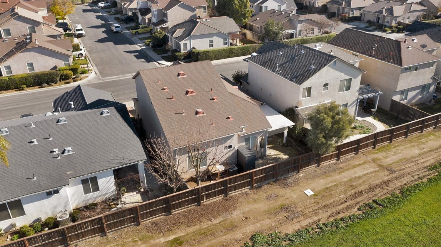 1968 North Tuscany Lane Clovis, CA 93619 - Photo 36 of 40 an aerial view of a house with a yard