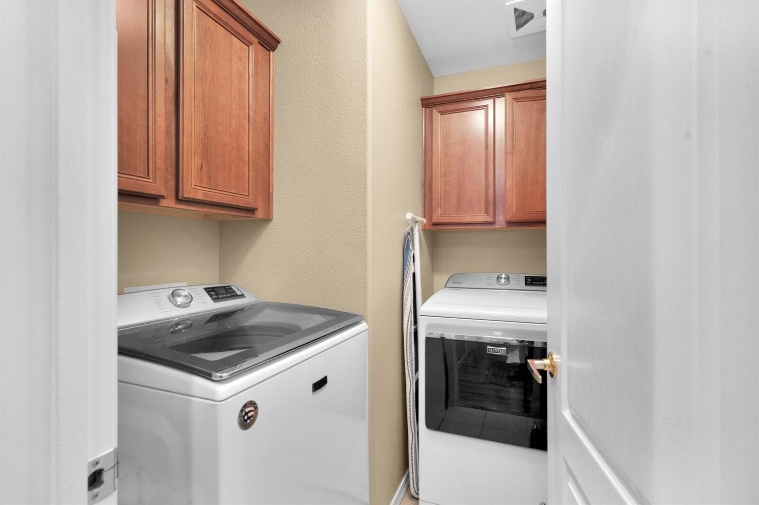 1968 North Tuscany Lane Clovis, CA 93619 - Photo 10 of 40 a kitchen with a sink and cabinets