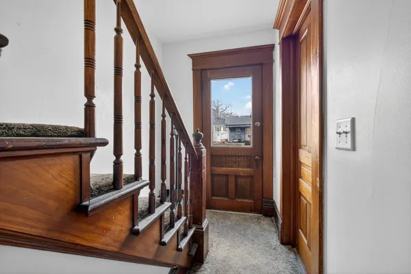 a view of front door with stairs
