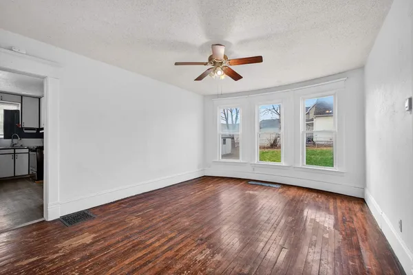 a view of room window and wooden floor