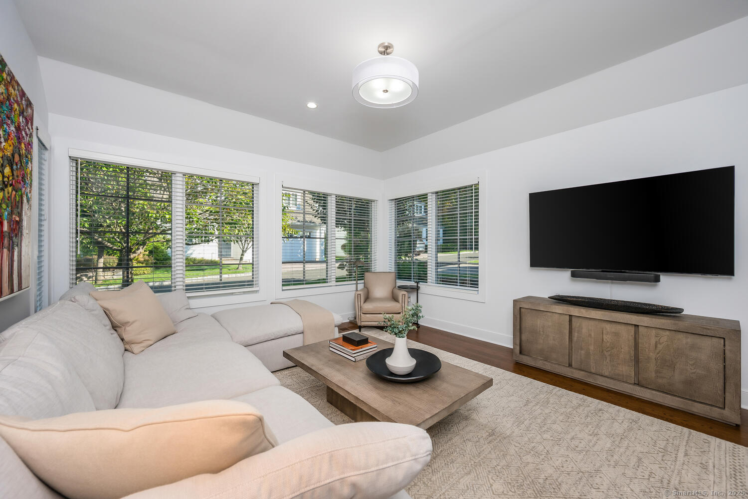 72 Kensett Lane Darien, CT 06820 - Photo 11 of 39 a living room with furniture and a flat screen tv